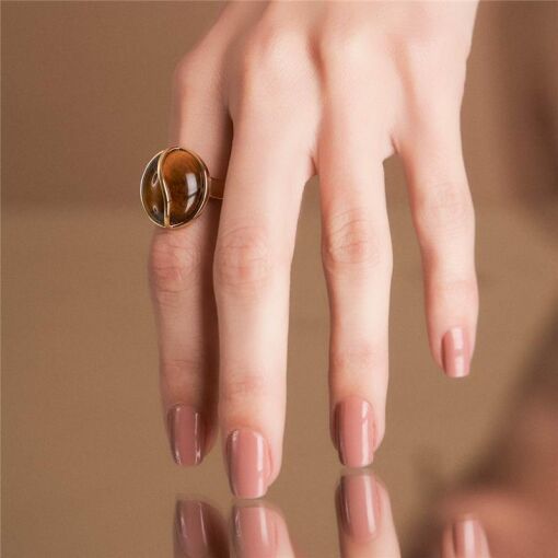 ANEL CURVO COM CRISTAL OVAL BANHADO A OURO