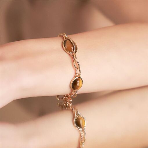 PULSEIRA COM CRISTAL OVAL E ELOS BANHADO A OURO
